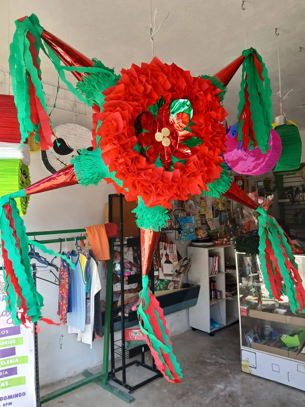 Round Christmas piñata with ribbons