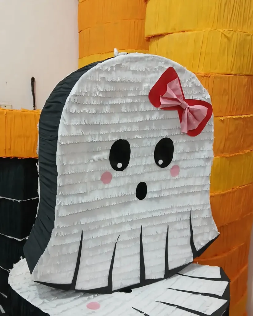 Ghost piñata with a bow