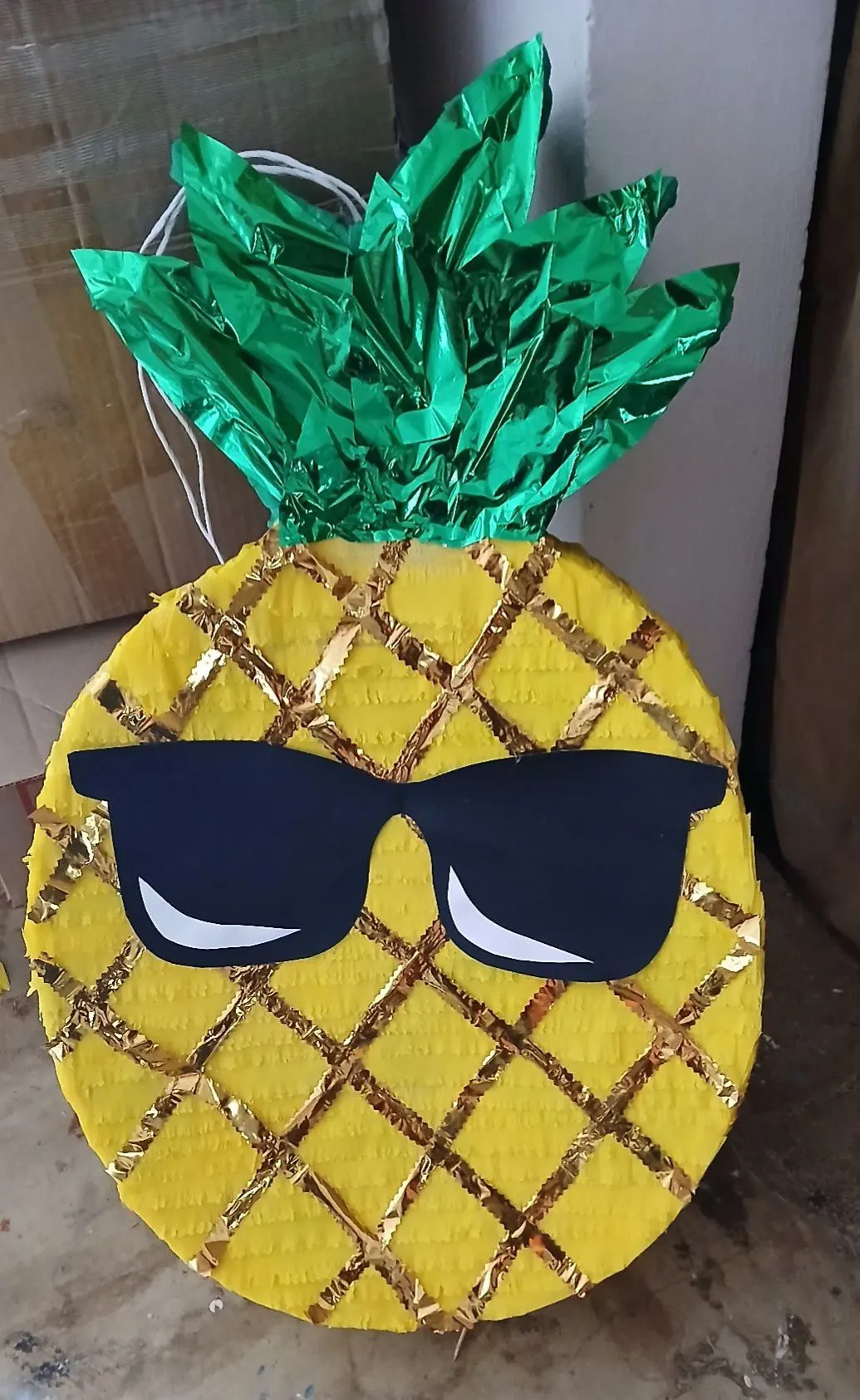 Pineapple piñata with sunglasses